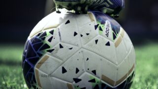 Soccer ball and cleat