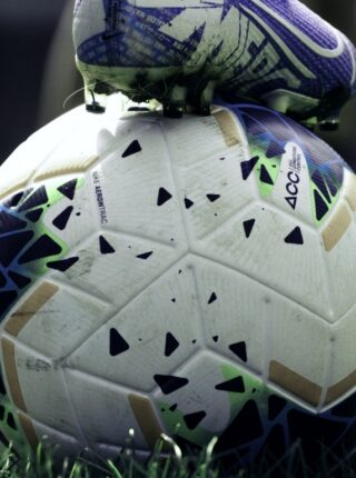 Soccer ball and cleat