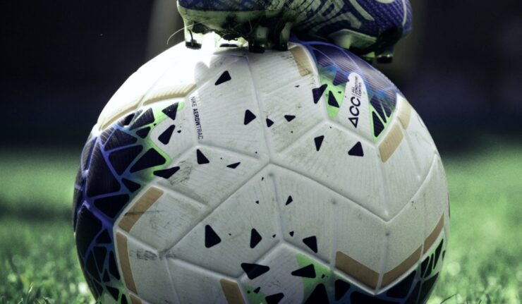 Soccer ball and cleat